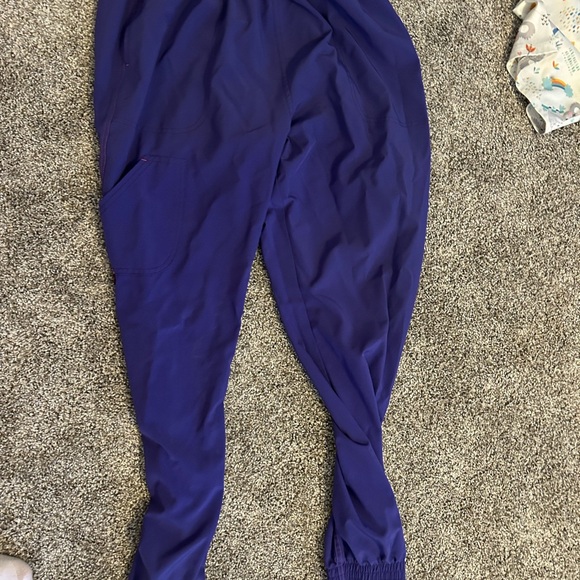 I have 6 scrub tops, one pair of scrub pants and 2 sets of scrubs. - Picture 3 of 3